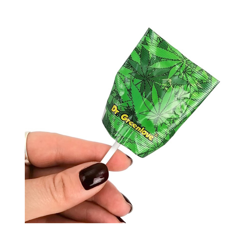 Konopné lízátko Dr. Greenlove v ruce.